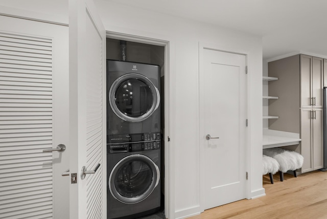 1212 Laurel St Unit 2005, Nashville, TN 37203 - laundry room with estacked washer and dryer and light wood-style flooring