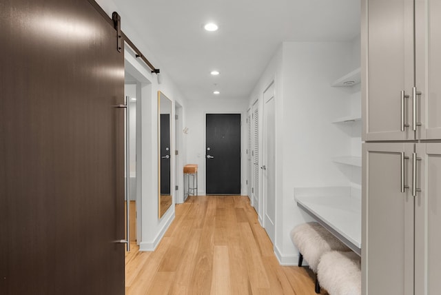 1212 Laurel St Unit 2005, Nashville, TN 37203 - hall with recessed lighting, light wood-style floors, baseboards, and a barn door