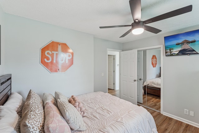 1006 Indian Trl, Castalian Springs, TN 37031 - bedroom featuring wood finished floors, ceiling fan, baseboards, a closet, and a textured ceiling