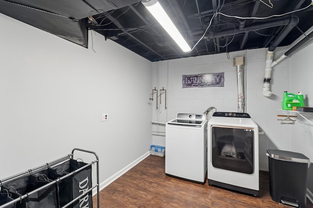 1006 Indian Trl, Castalian Springs, TN 37031 - laundry area with washing machine and clothes dryer, dark wood-type flooring, and concrete block wall