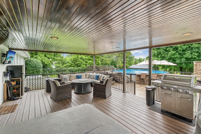 1006 Indian Trl, Castalian Springs, TN 37031 - wooden terrace with outdoor lounge area, view of scattered trees, and a grill