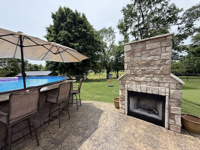 1006 Indian Trl, Castalian Springs, TN 37031 - view of patio featuring an outdoor stone fireplace