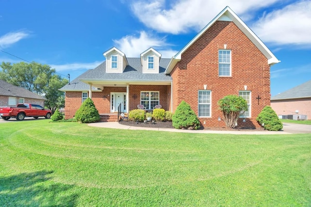 505 Ellie Lee Dr, Smyrna, TN 37167 - view of front of home featuring brick siding, a front lawn, and a shingled roof