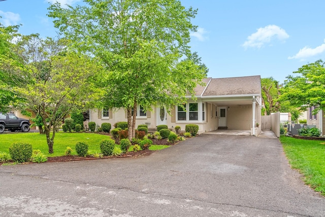 2505 Buckner Dr, Hopkinsville, KY 42240 - view of front facade featuring asphalt driveway, an attached carport, and stucco siding