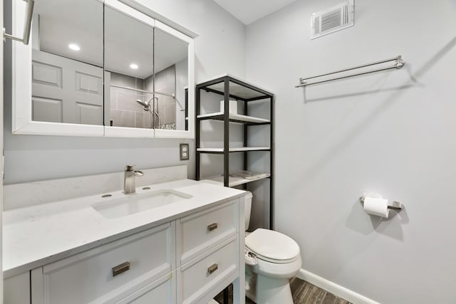 445 Belinda Pkwy, Mount Juliet, TN 37122 - bathroom featuring toilet, vanity, wood finished floors, tiled shower, and baseboards