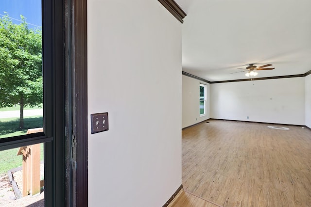 445 Belinda Pkwy, Mount Juliet, TN 37122 - unfurnished room featuring healthy amount of natural light, wood finished floors, a ceiling fan, baseboards, and crown molding