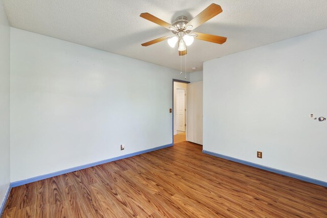 445 Belinda Pkwy, Mount Juliet, TN 37122 - spare room with wood finished floors, baseboards, ceiling fan, and a textured ceiling