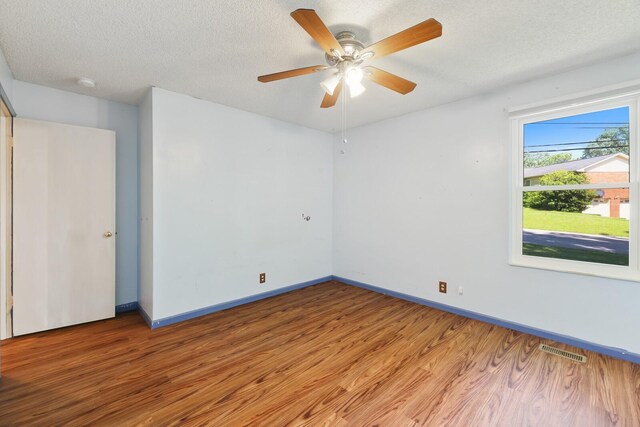 445 Belinda Pkwy, Mount Juliet, TN 37122 - empty room with light wood-type flooring, baseboards, a ceiling fan, a textured ceiling, and a smoke detector