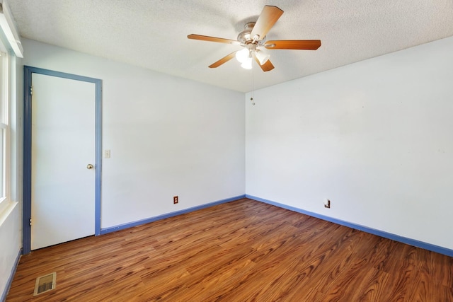 445 Belinda Pkwy, Mount Juliet, TN 37122 - unfurnished room featuring wood finished floors, a ceiling fan, baseboards, and a textured ceiling