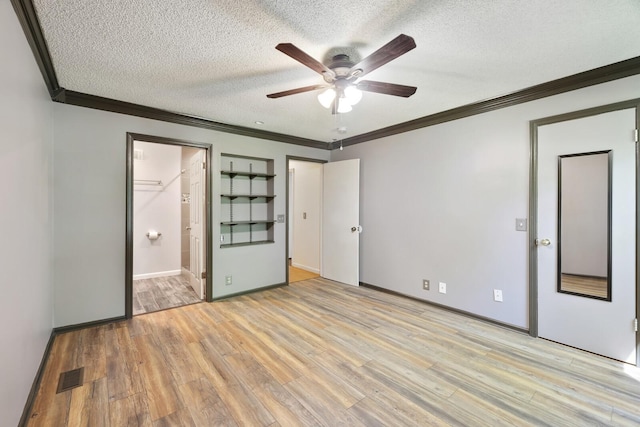 445 Belinda Pkwy, Mount Juliet, TN 37122 - unfurnished bedroom featuring crown molding, a textured ceiling, light wood-style floors, baseboards, and ensuite bath