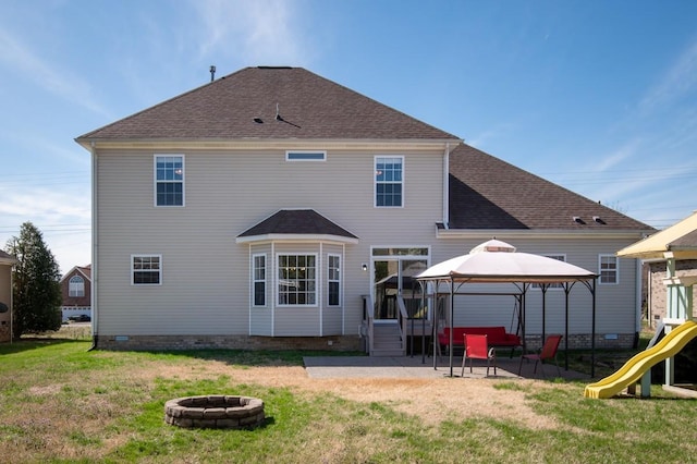1300 Wentworth Dr, Gallatin, TN 37066 - rear view of property featuring an outdoor fire pit, a gazebo, a patio, a yard, and a playground