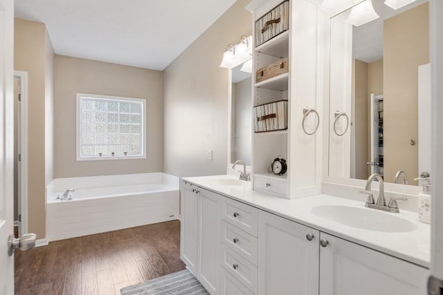 1300 Wentworth Dr, Gallatin, TN 37066 - bathroom featuring double vanity, a garden tub, and wood finished floors