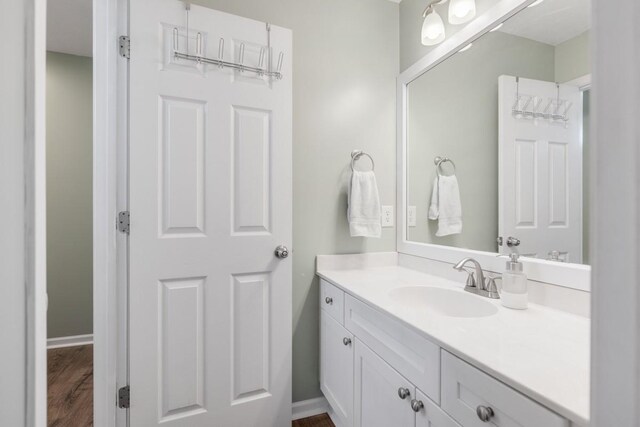 1300 Wentworth Dr, Gallatin, TN 37066 - bathroom featuring vanity, wood finished floors, and baseboards
