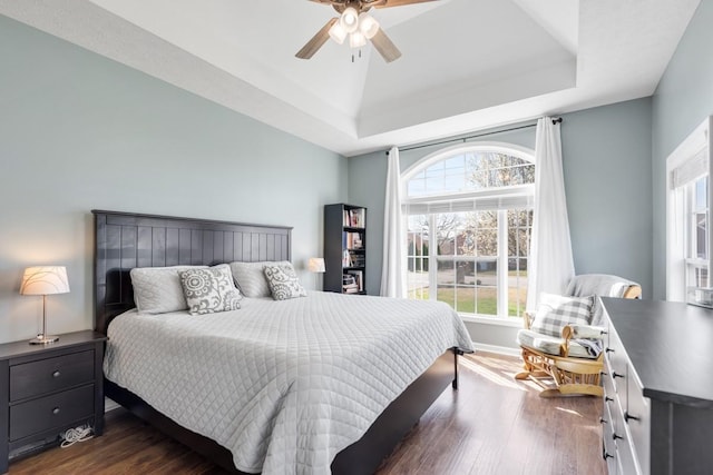 1300 Wentworth Dr, Gallatin, TN 37066 - bedroom featuring a tray ceiling, dark wood-type flooring, baseboards, and a ceiling fan