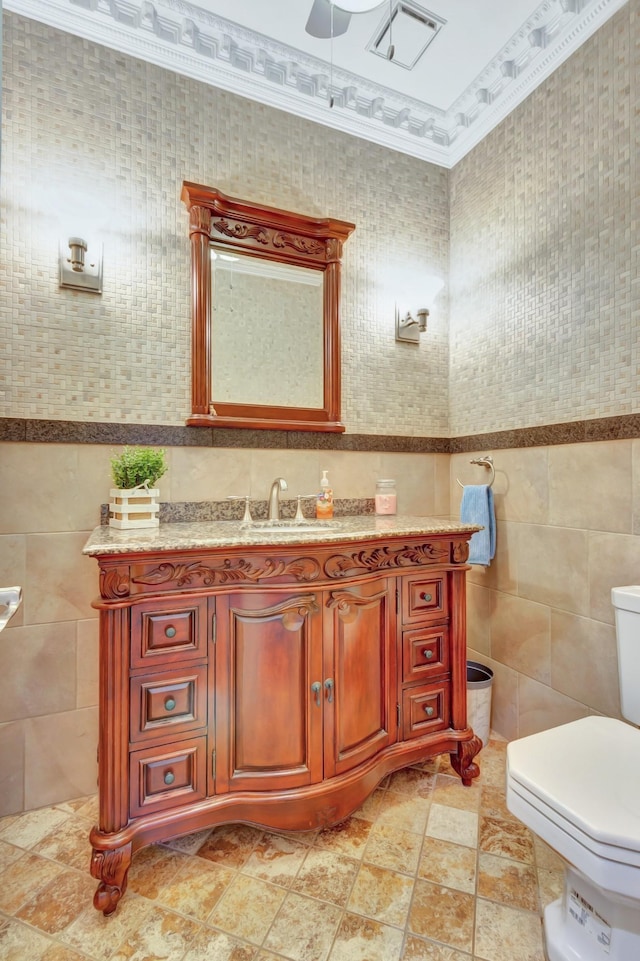 1838 Oreilly Cir, Spring Hill, TN 37174 - half bathroom featuring tile walls, toilet, vanity, and a ceiling fan