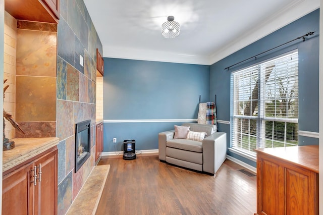 1838 Oreilly Cir, Spring Hill, TN 37174 - sitting room featuring wood finished floors, a fireplace, crown molding, and baseboards