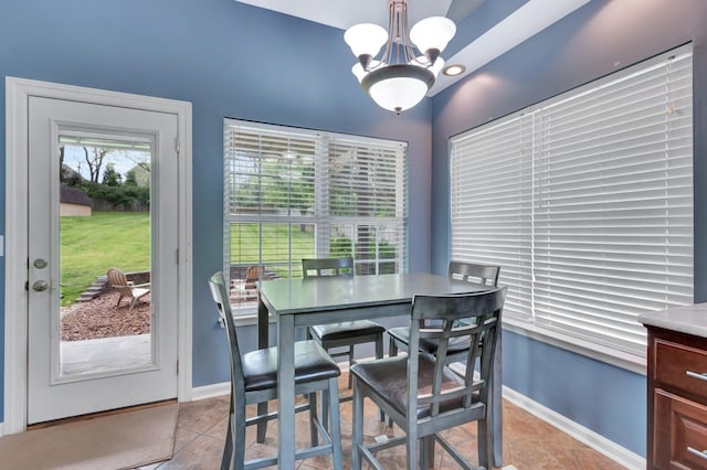 1838 Oreilly Cir, Spring Hill, TN 37174 - dining area with a chandelier, light tile patterned floors, and baseboards