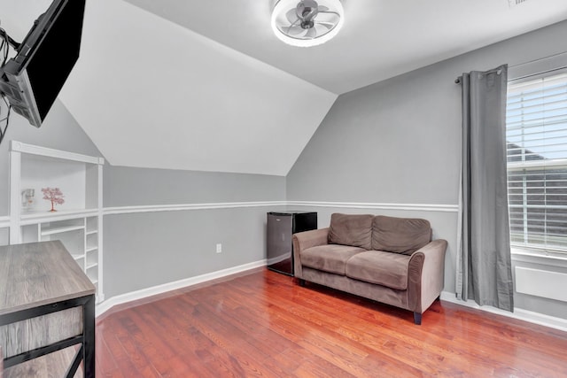 1838 Oreilly Cir, Spring Hill, TN 37174 - living area featuring wood finished floors, vaulted ceiling, ceiling fan, and baseboards