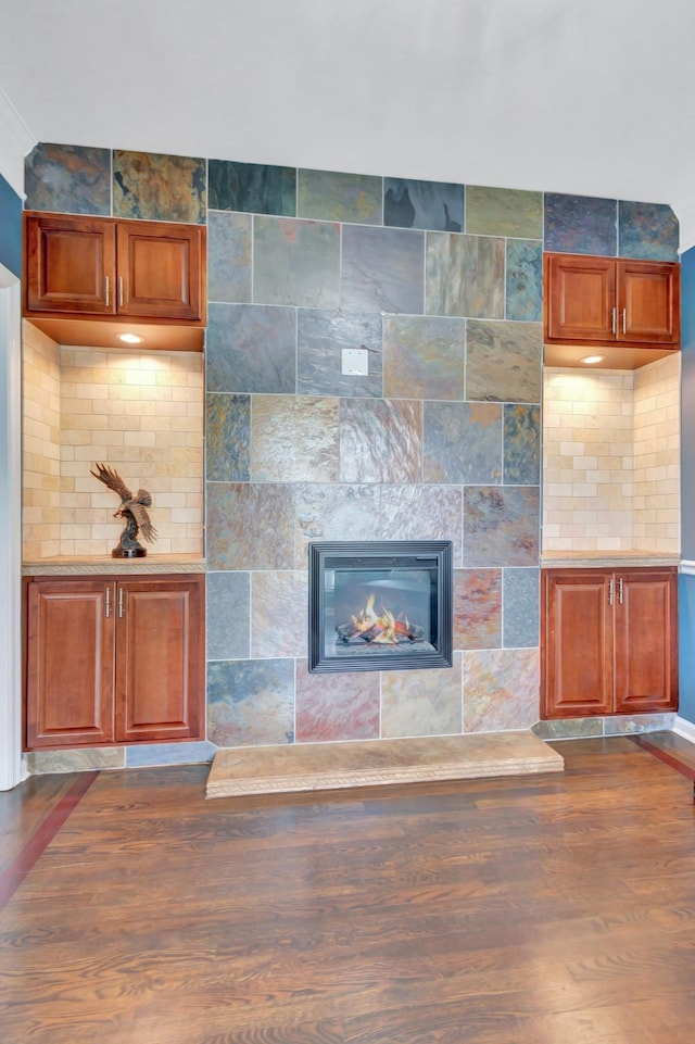 1838 Oreilly Cir, Spring Hill, TN 37174 - unfurnished living room with dark wood-style flooring and a large fireplace