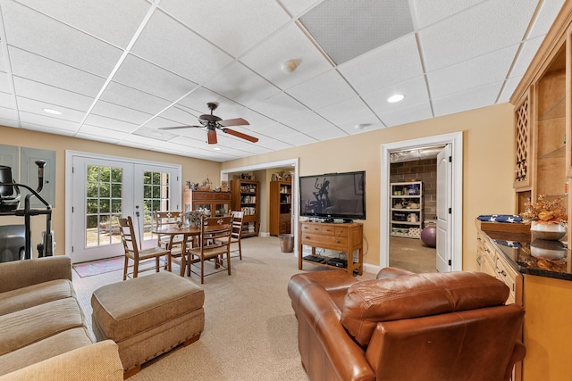 15687 Columbia Hwy, Lynnville, TN 38472 - living area featuring a drop ceiling, light colored carpet, a ceiling fan, french doors, and recessed lighting