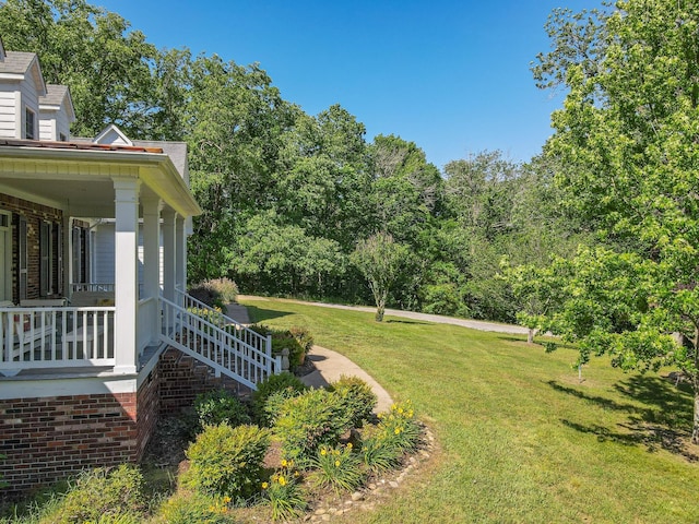15687 Columbia Hwy, Lynnville, TN 38472 - view of green lawn with a porch