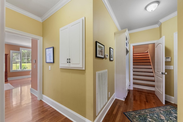 15687 Columbia Hwy, Lynnville, TN 38472 - hall featuring wood finished floors, crown molding, baseboards, and stairs