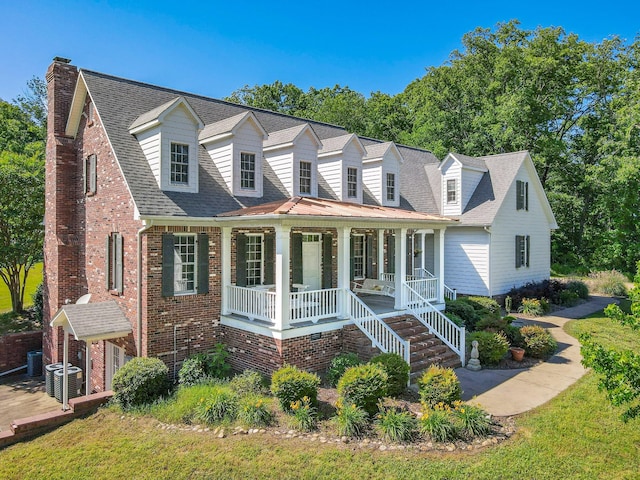 15687 Columbia Hwy, Lynnville, TN 38472 - cape cod home with a porch, a chimney, central air condition unit, brick siding, and roof with shingles