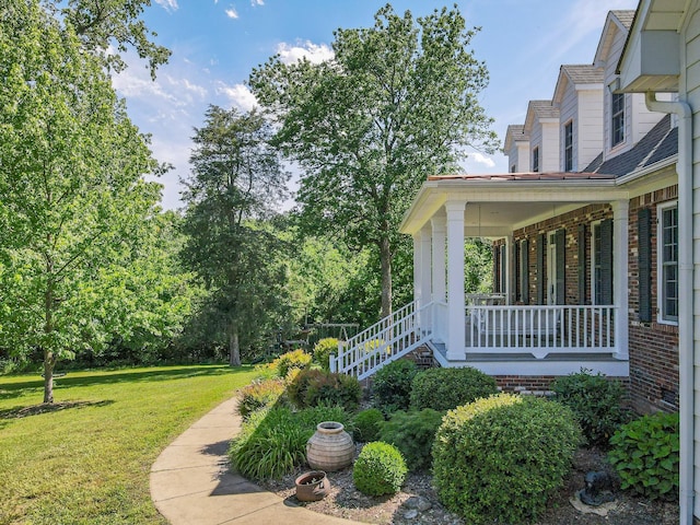 15687 Columbia Hwy, Lynnville, TN 38472 - view of green lawn featuring a porch