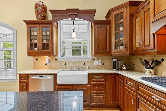 15687 Columbia Hwy, Lynnville, TN 38472 - kitchen featuring appliances with stainless steel finishes, a sink, backsplash, and light stone countertops