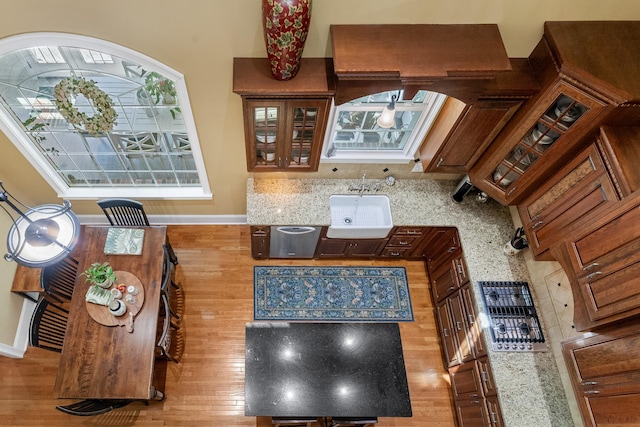 15687 Columbia Hwy, Lynnville, TN 38472 - kitchen with wood finished floors, baseboards, and glass insert cabinets