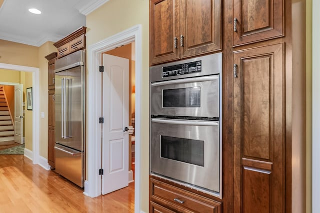 15687 Columbia Hwy, Lynnville, TN 38472 - kitchen with appliances with stainless steel finishes, ornamental molding, light wood-style floors, baseboards, and recessed lighting