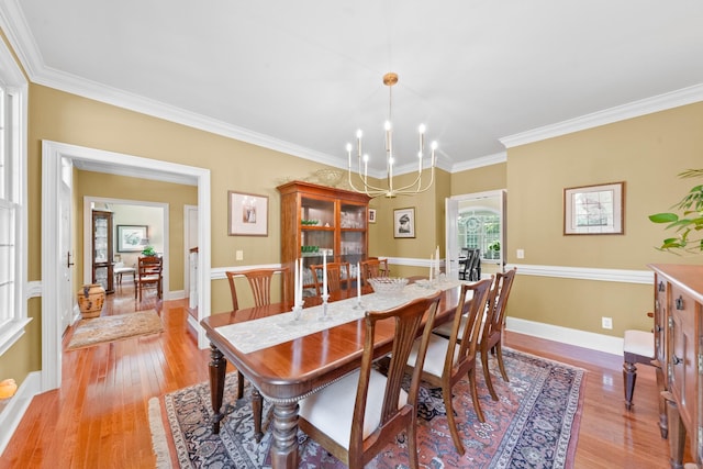 15687 Columbia Hwy, Lynnville, TN 38472 - dining room featuring light wood finished floors, crown molding, a chandelier, and baseboards