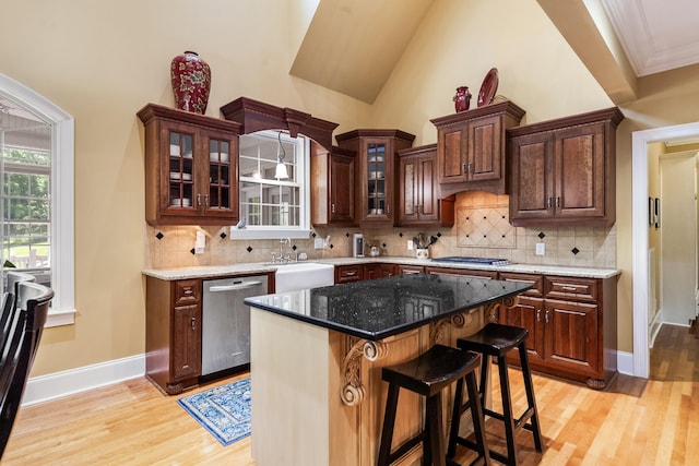 15687 Columbia Hwy, Lynnville, TN 38472 - kitchen featuring stainless steel appliances, a sink, light wood-type flooring, backsplash, and ornamental molding