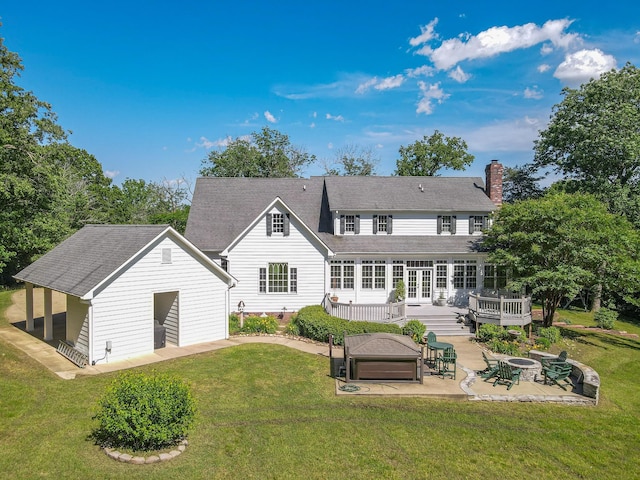 15687 Columbia Hwy, Lynnville, TN 38472 - back of house featuring a patio, a fire pit, a wooden deck, and a yard