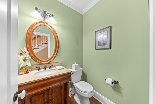 15687 Columbia Hwy, Lynnville, TN 38472 - bathroom with ornamental molding, toilet, vanity, baseboards, and wood finished floors