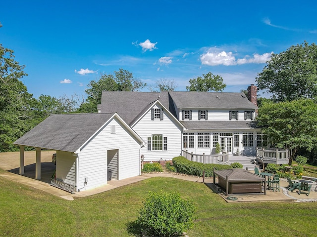 15687 Columbia Hwy, Lynnville, TN 38472 - rear view of house featuring a patio, a chimney, a yard, a deck, and roof with shingles