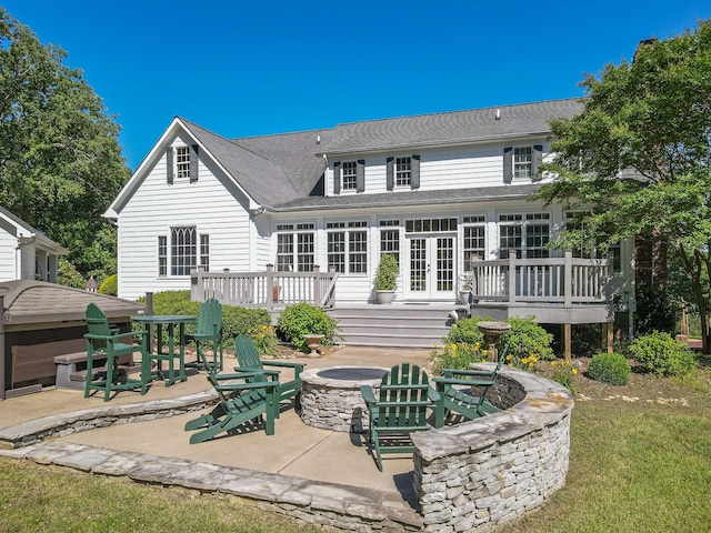 15687 Columbia Hwy, Lynnville, TN 38472 - back of house with a fire pit, french doors, a patio, a deck, and roof with shingles