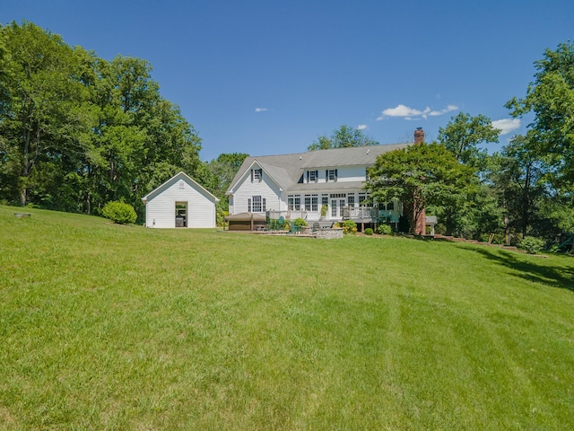 15687 Columbia Hwy, Lynnville, TN 38472 - view of grassy yard with a deck and an outdoor structure