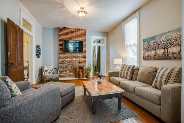 959 Glass St, Franklin, TN 37064 - living area with wood finished floors and a brick fireplace