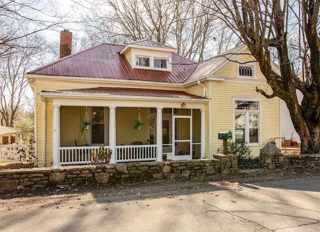 959 Glass St, Franklin, TN 37064 - view of front of house featuring a chimney, metal roof, and a porch