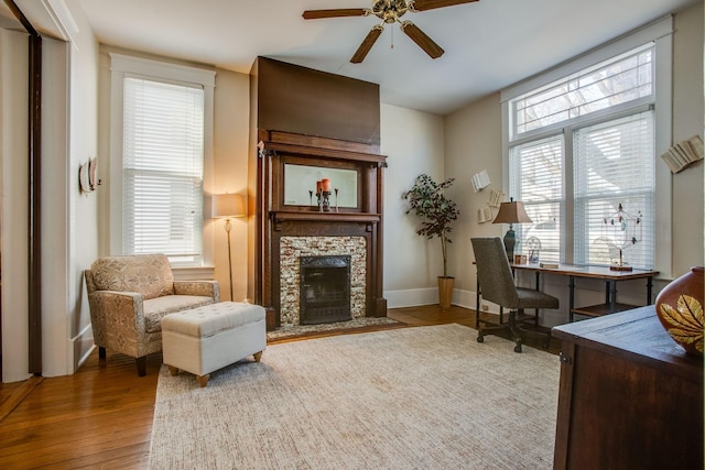 959 Glass St, Franklin, TN 37064 - office space with a ceiling fan, wood-type flooring, a stone fireplace, and baseboards