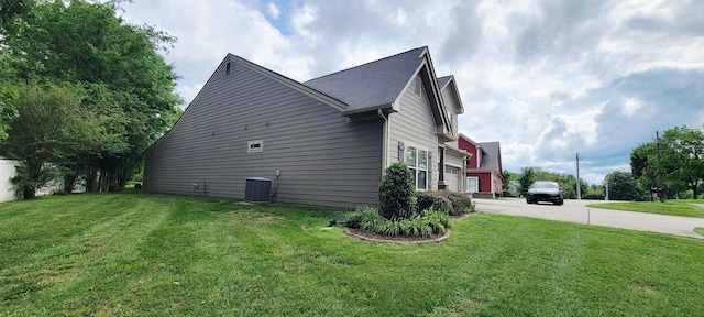 222 Pumphill Rd, Dickson, TN 37055 - view of side of home with a lawn, driveway, and cooling unit