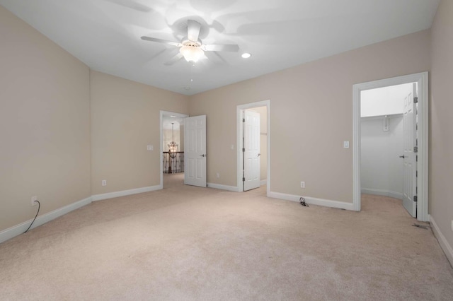 3037 Flagstone Dr, Franklin, TN 37069 - unfurnished bedroom featuring light carpet, a spacious closet, baseboards, and ceiling fan