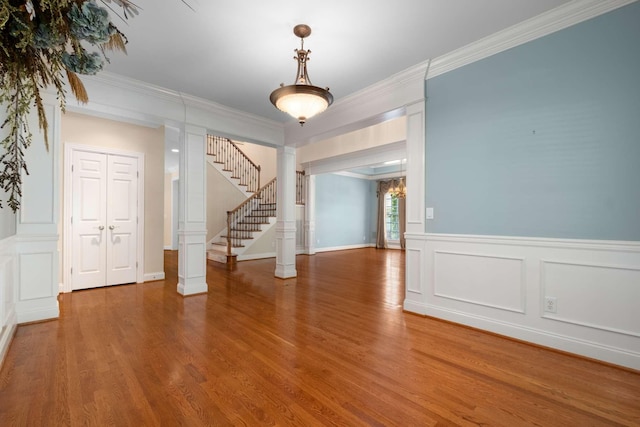 3037 Flagstone Dr, Franklin, TN 37069 - foyer entrance featuring crown molding, wood finished floors, wainscoting, stairway, and a decorative wall
