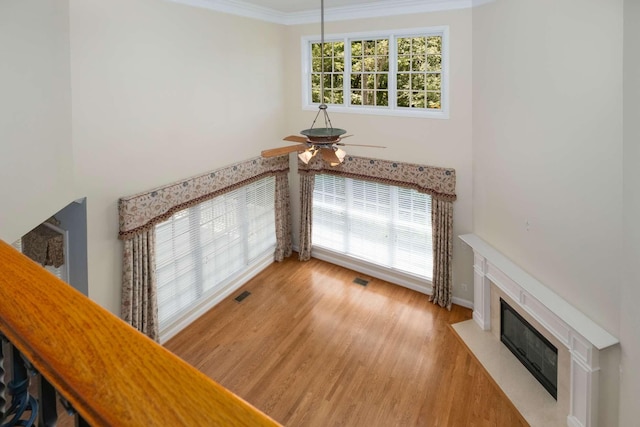 3037 Flagstone Dr, Franklin, TN 37069 - stairway featuring a ceiling fan, a fireplace, wood finished floors, crown molding, and baseboards