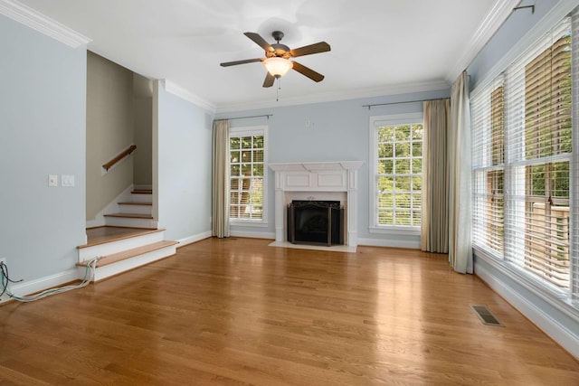 3037 Flagstone Dr, Franklin, TN 37069 - unfurnished living room featuring light wood-type flooring, stairway, a ceiling fan, a fireplace with flush hearth, and baseboards