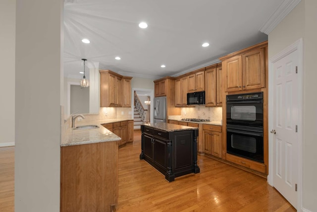 3037 Flagstone Dr, Franklin, TN 37069 - kitchen featuring black appliances, a sink, crown molding, backsplash, and light stone countertops