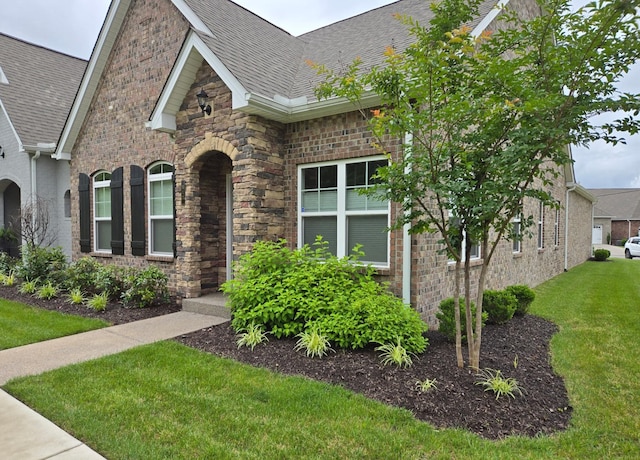 312 Buckner Cir, Mount Juliet, TN 37122 - view of front facade featuring a front yard, a shingled roof, and brick siding