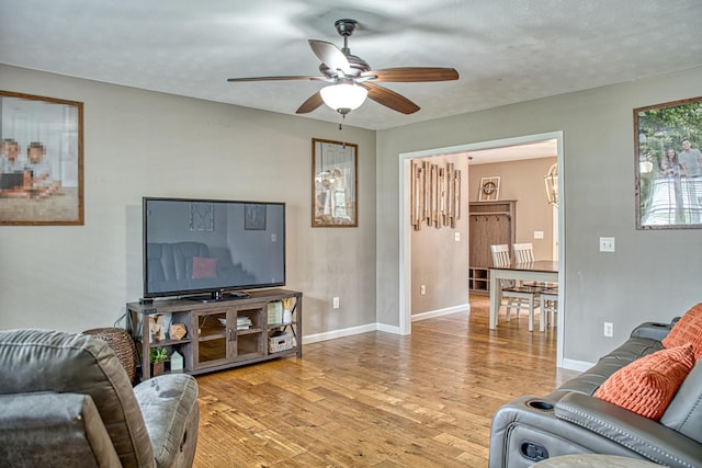 143 Rachelle Pl, Baxter, TN 38544 - living room with ceiling fan, light wood finished floors, and baseboards