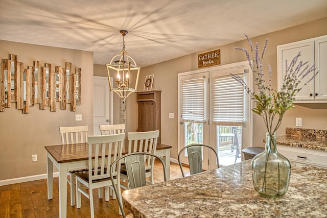 143 Rachelle Pl, Baxter, TN 38544 - dining space with a chandelier, light wood finished floors, and baseboards